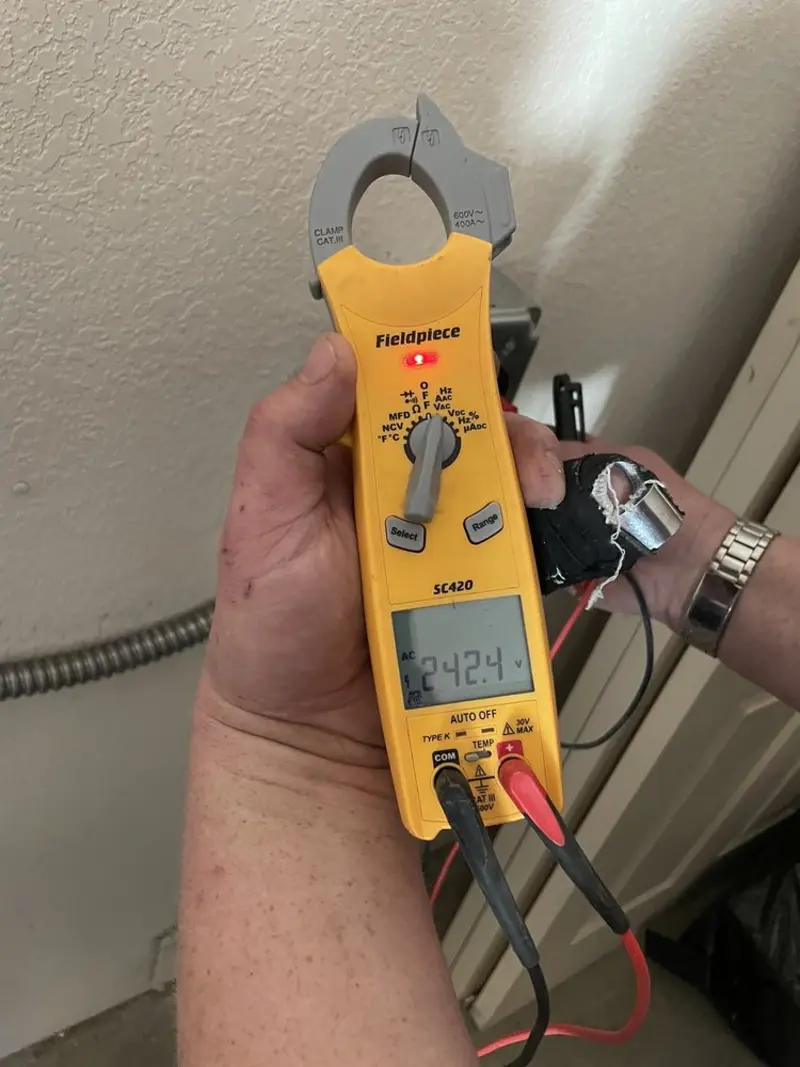 Voltage testing with clamp meter during Electrical Installation Services in Waterloo